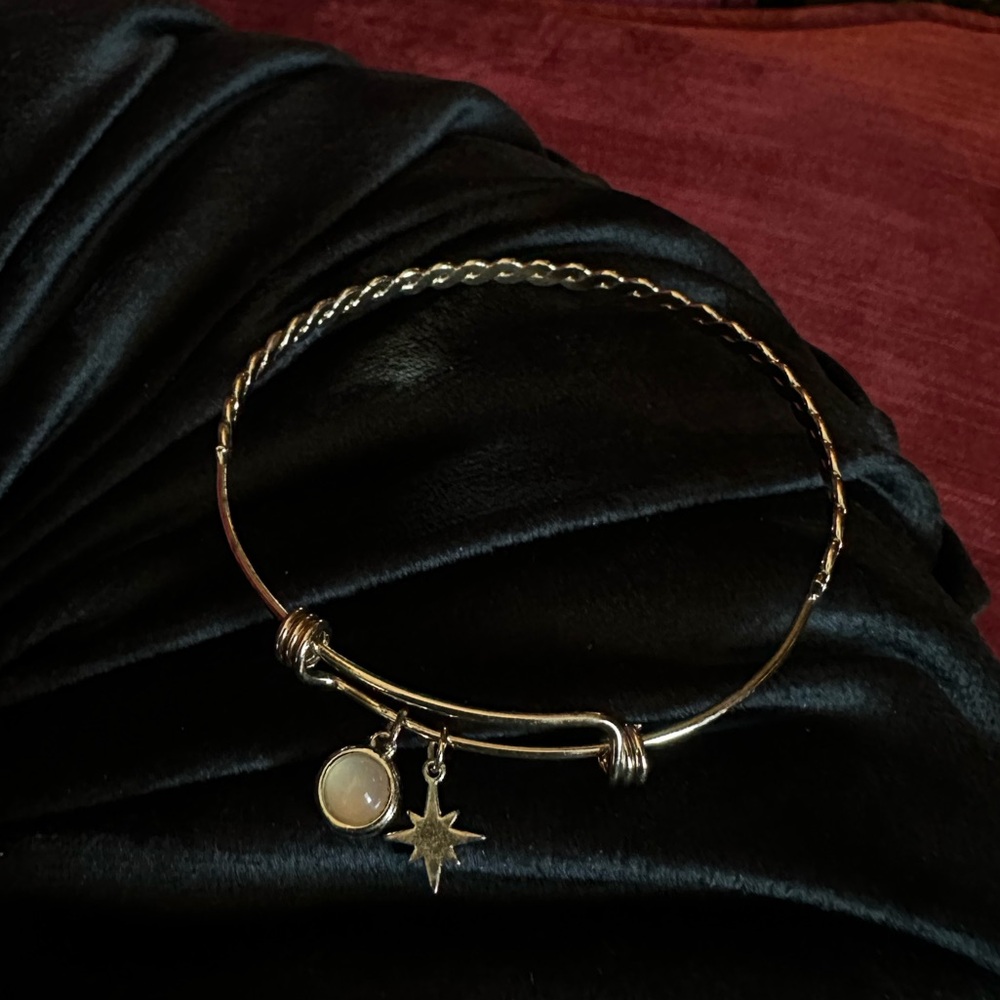ASOS DESIGN gold bangle bracelet with opal and star charm
